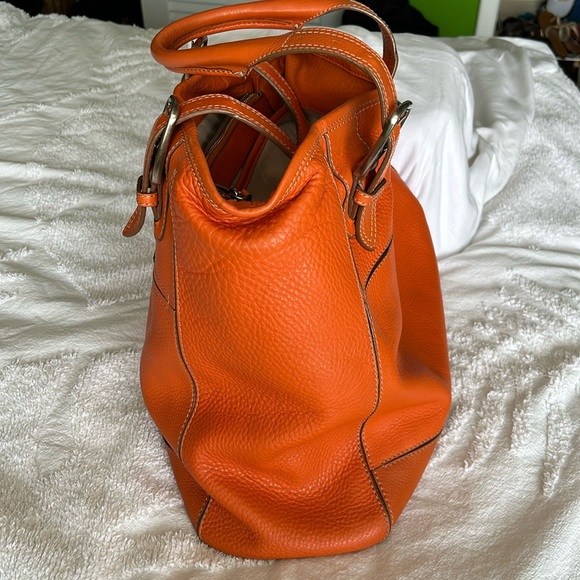 Large leather Cole Haan orange shoulder bag with silver hardware buckles. - Picture 3 of 16